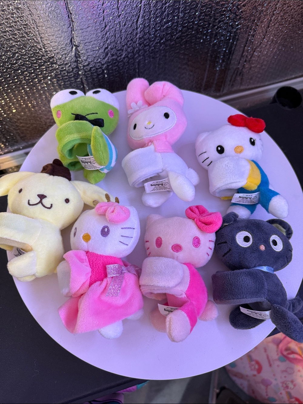 Lot of 7 hello kitty & friend slap bracelets. Displayed only